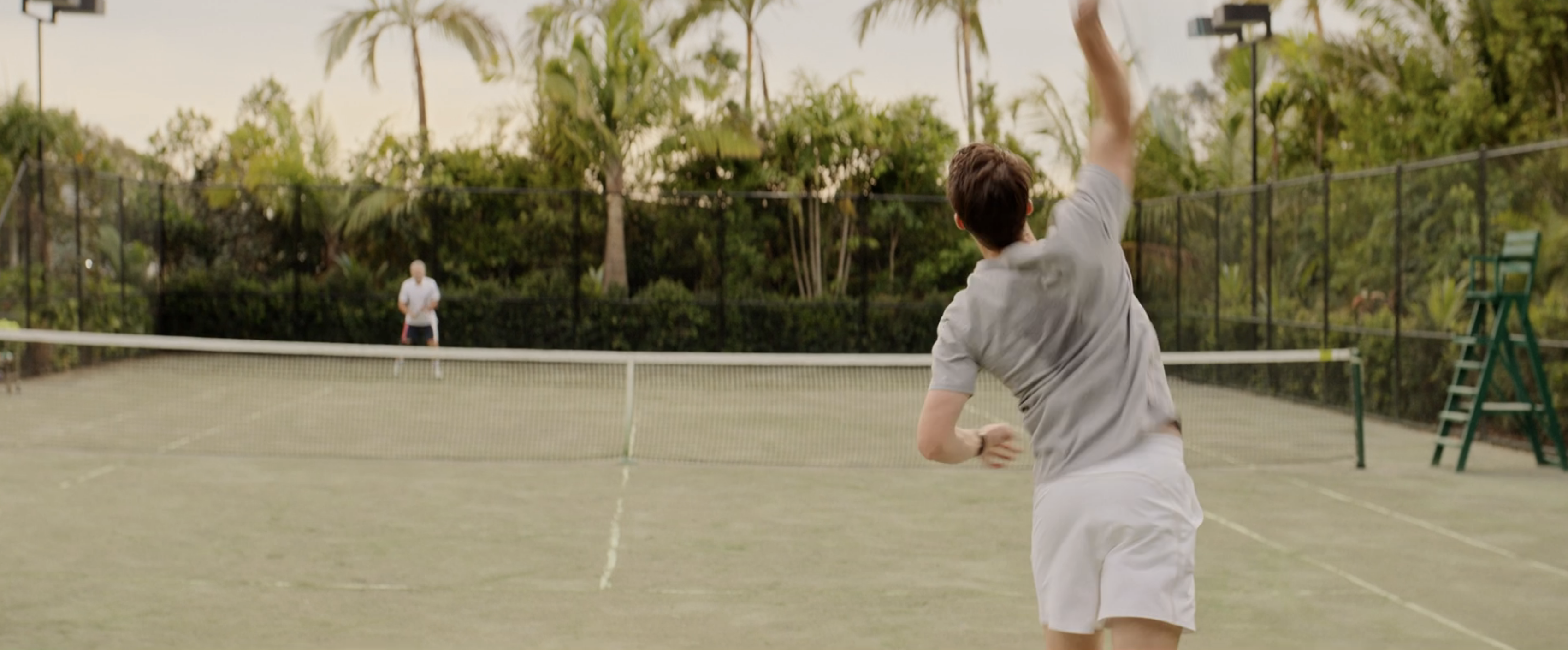 a man serving in tennis in Apples Never Fall